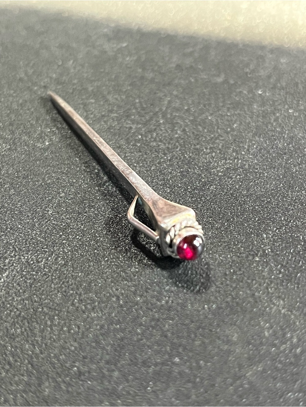 Sterling silver horseshoe nail pendant with red gem top. Solid. Stamped. 925